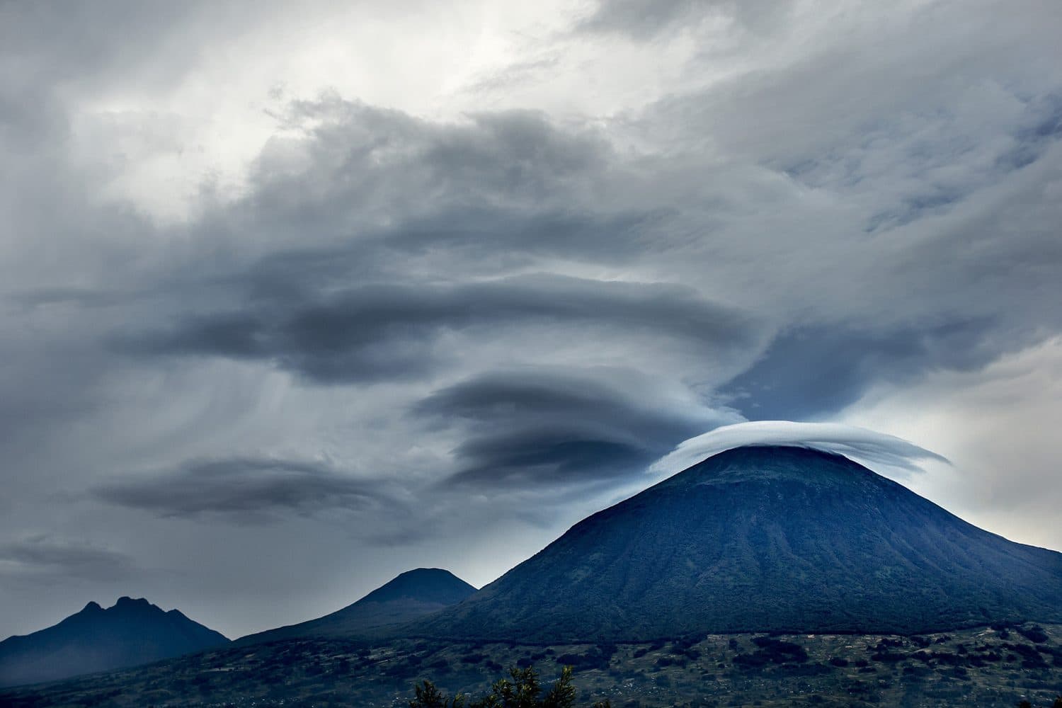 A Virunga volcano under a crown of cloud
